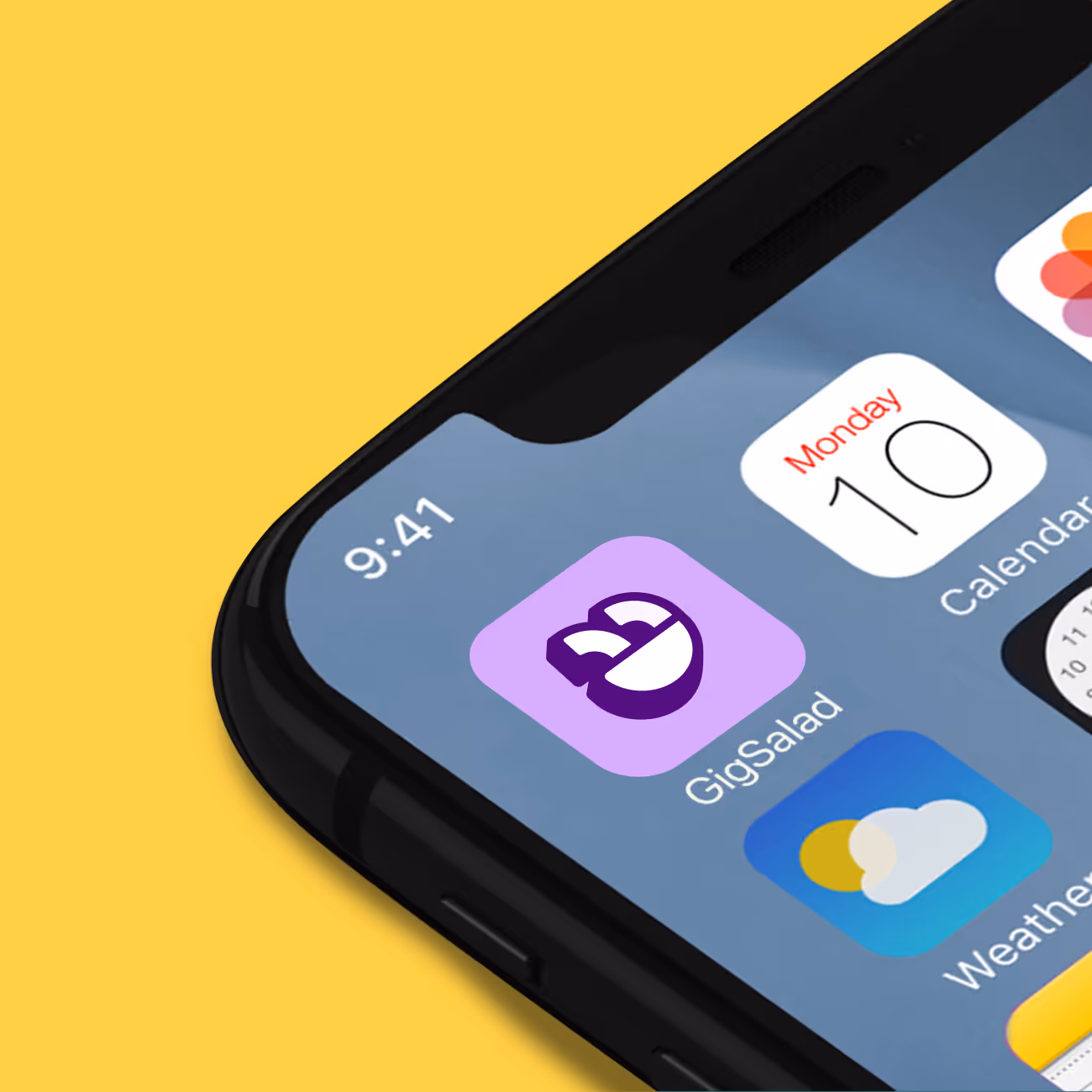 Close-up of a smartphone screen showing the GigSalad app icon along with Calendar and Weather apps on a yellow background.