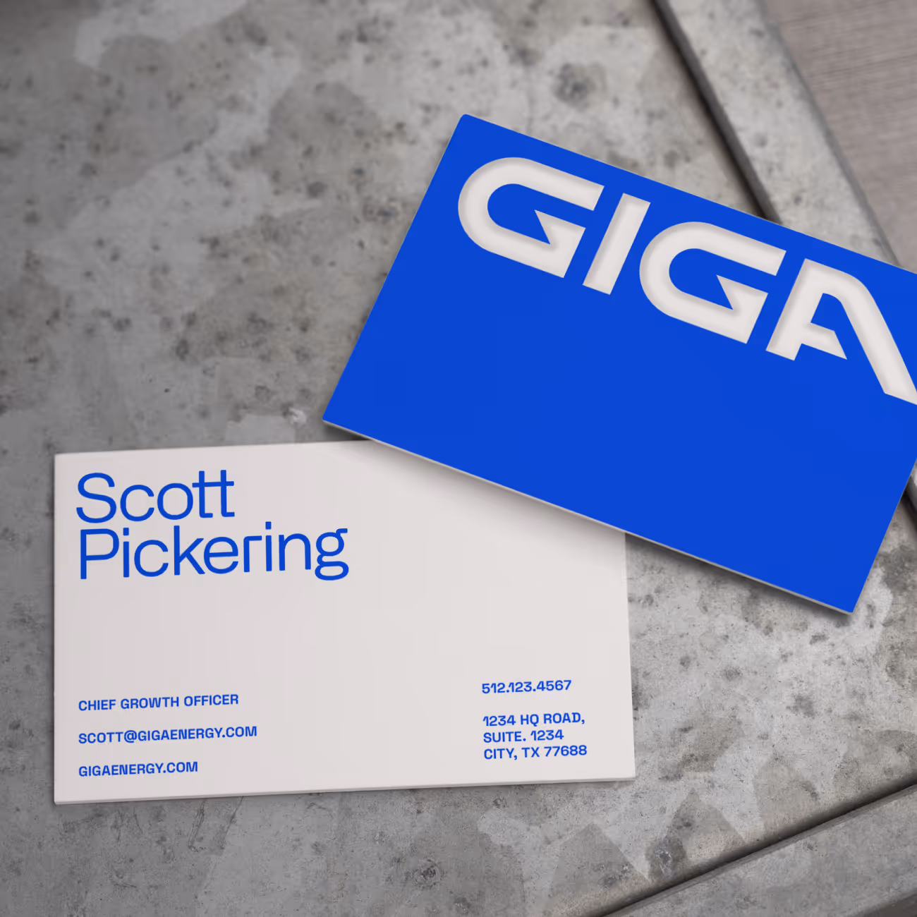 Business card for Scott Pickering, Chief Growth Officer at GIGA, with contact info on concrete background.
