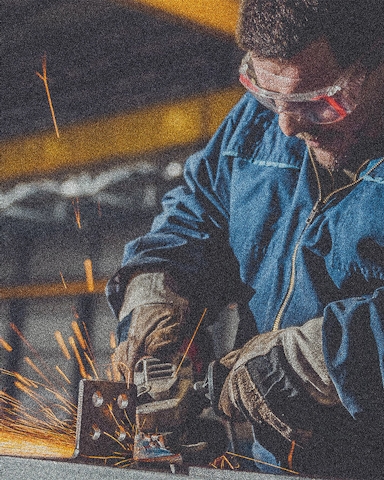Worker using angle grinder