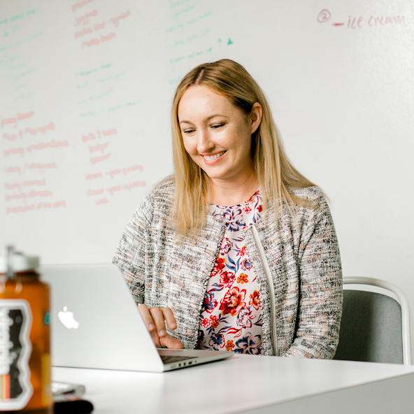 A brand writer works on a communications deliverable.